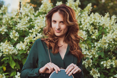 Portrait of smiling young woman outdoors