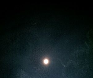 Low angle view of moon against sky at night