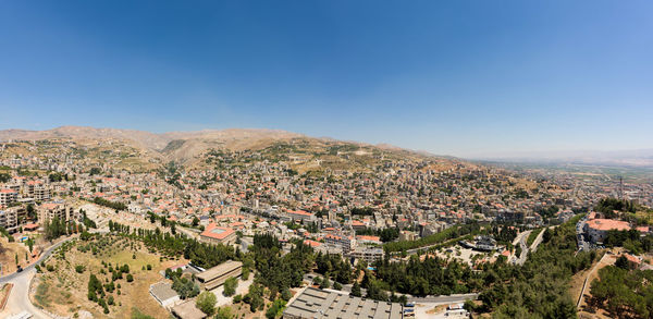High angle shot of townscape against clear blue sky