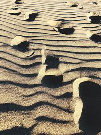 High angle view of shadow on sand at beach