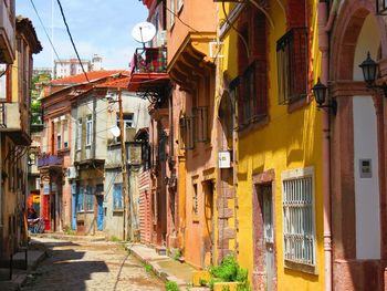 Alley amidst buildings in city