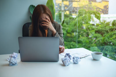 Woman using laptop at home