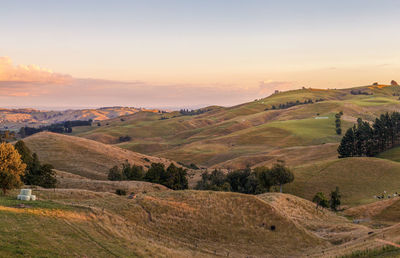Scenic view of landscape against sky during sunset