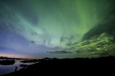 Scenic view of silhouette landscape against sky at night