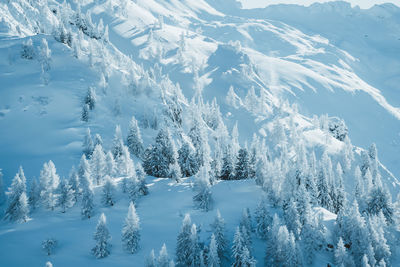 Scenic view of snow covered mountains against sky