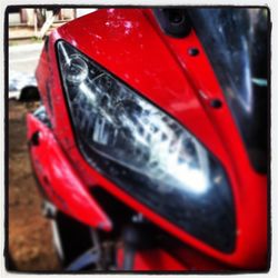 Close-up of car on road