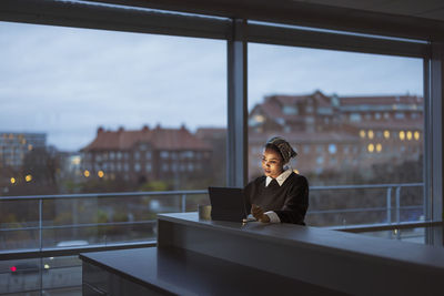 Young woman working on laptop