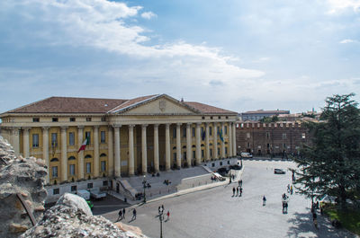 Buildings against cloudy sky