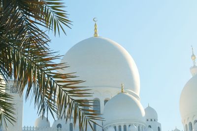 Low angle view of mosque building against clear sky