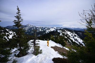 A scenic view of snowcapped mountains against the sky.