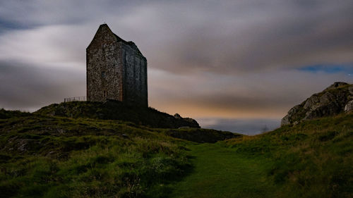 View of castle against cloudy sky