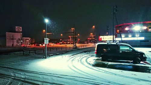 Cars on street in winter at night