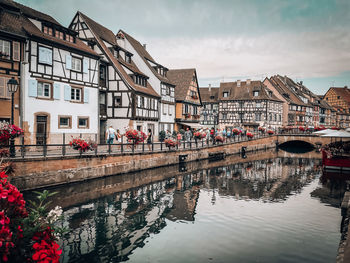 Canal amidst buildings in city