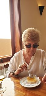 Woman eating at restaurant