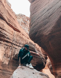 Rear view of person on rock