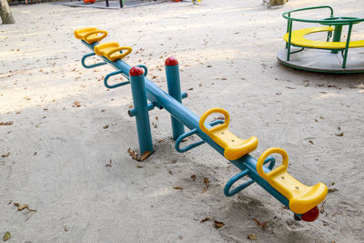 High angle view of toy on sand at playground