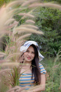 Portrait of smiling woman wearing hat