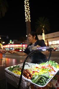 Man having food in restaurant at night
