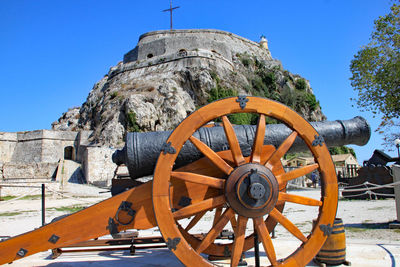 Old ruin by trees against clear sky