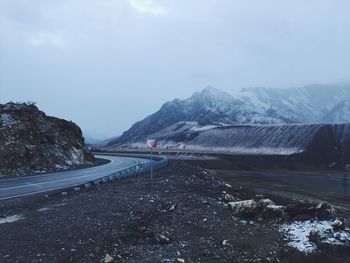 Road by mountains against sky. altay