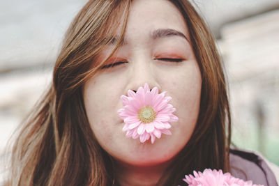 Close-up of beautiful woman with flowers