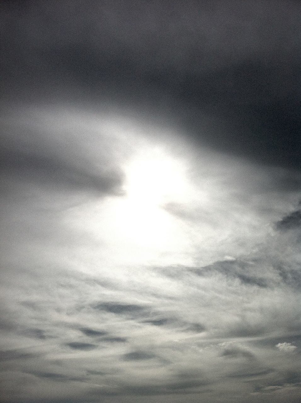 sky, cloud - sky, low angle view, cloudy, beauty in nature, sky only, tranquility, scenics, sun, nature, weather, tranquil scene, sunbeam, cloudscape, backgrounds, idyllic, sunlight, cloud, overcast, full frame