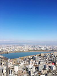 High angle view of townscape against blue sky