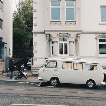 CARS PARKED IN FRONT OF BUILDINGS