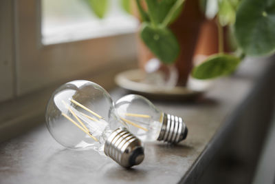 Light bulbs on windowsill