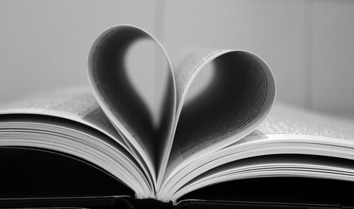 Close-up of heart shape on book