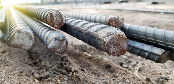 Close-up of rusty pipe on field