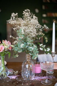 Flowers in glass vase on table