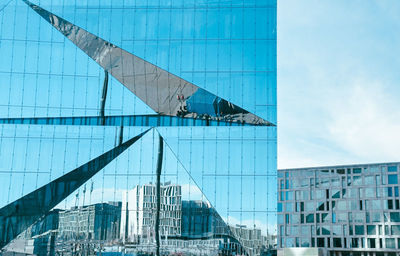 Low angle view of modern buildings against sky