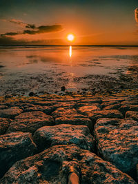 Scenic view of sea against sky during sunset