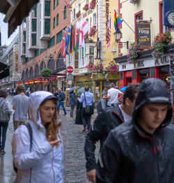 People walking on street in city