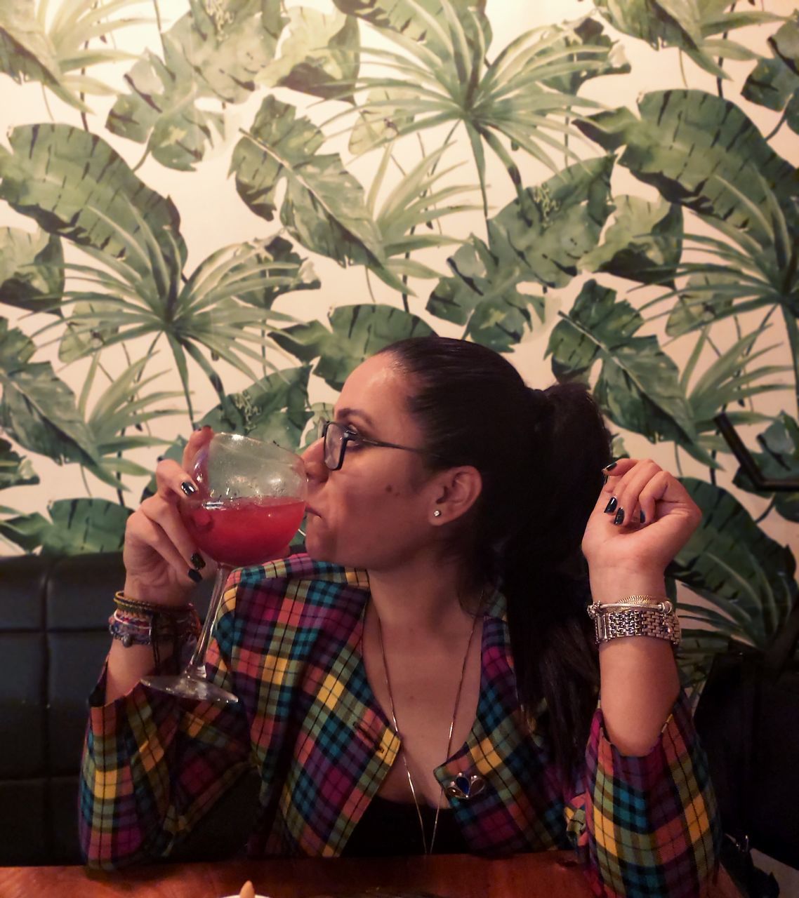 drink, refreshment, food and drink, one person, real people, young adult, lifestyles, drinking, glass, leisure activity, casual clothing, glasses, plant, alcohol, holding, leaf, headshot, adult, front view, hairstyle, cocktail