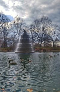 Scenic view of lake against cloudy sky