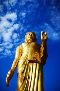 Low angle view of statue against sky