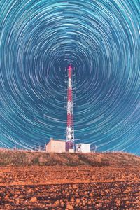 Scenic view of tower against sky at night