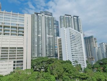 Modern buildings in city against sky