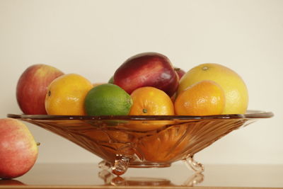 Close-up of apples and fruits on white background