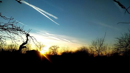 Silhouette landscape against sky during sunset