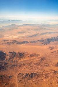 Aerial view of landscape against sky during sunset