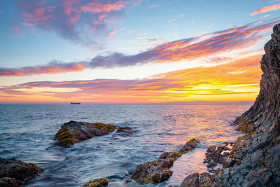 Scenic view of sea against sky during sunset