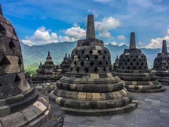 View of temple against cloudy sky