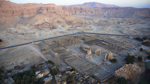 Aerial view medinet habu temple from hot air balloon with valley of the kings skyline luxor egypt