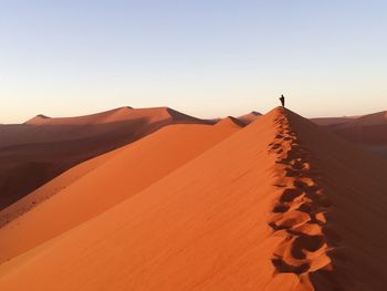 Scenic view of desert against clear sky