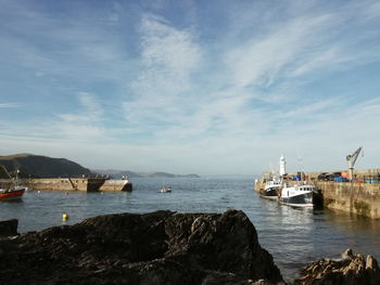 Boats moored at harbor