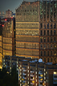 Buildings in city at night