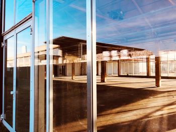 Reflection of building on glass window